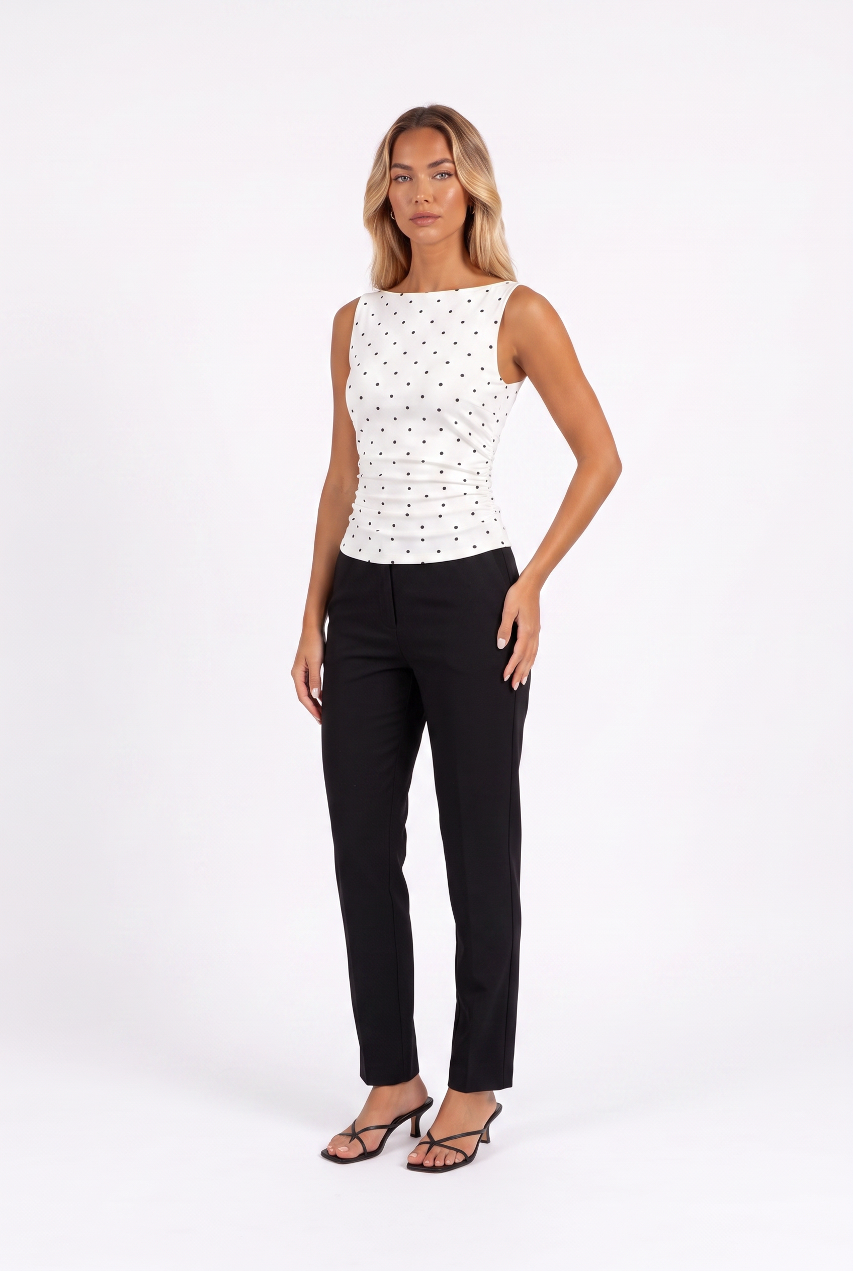 White polka-dot boat-neck sleeveless top with tie back — three-quarter